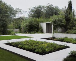 Cozy house exterior with landscape and paths with green flower beds